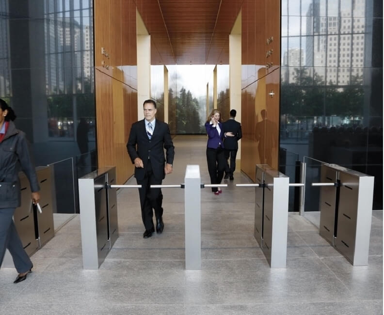 People are passing the turnstiles with Anviz biometric access control terminals